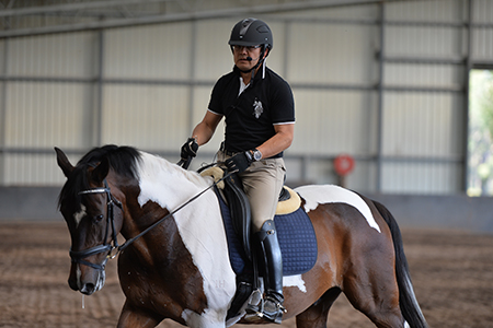 Gary doesn't mind getting in the saddle to show what he means