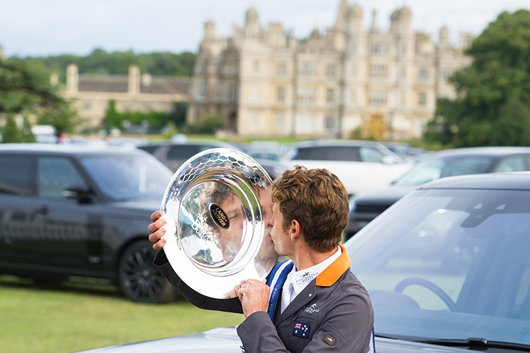 THE LAND ROVER BURGHLEY HORSE TRIALS , BURGHLEY HOUSE, STAMFORD, LINCOLNSHIRE, ENGLAND, 4TH SEPT 2016, CRISTOPHER BURTON KISSES THE LAND ROVER PERPETUAL CHALLENGE TROPHY IN FRONT OF BURGHLEY HOUSE